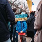 a kid protesting against the war in ukraine